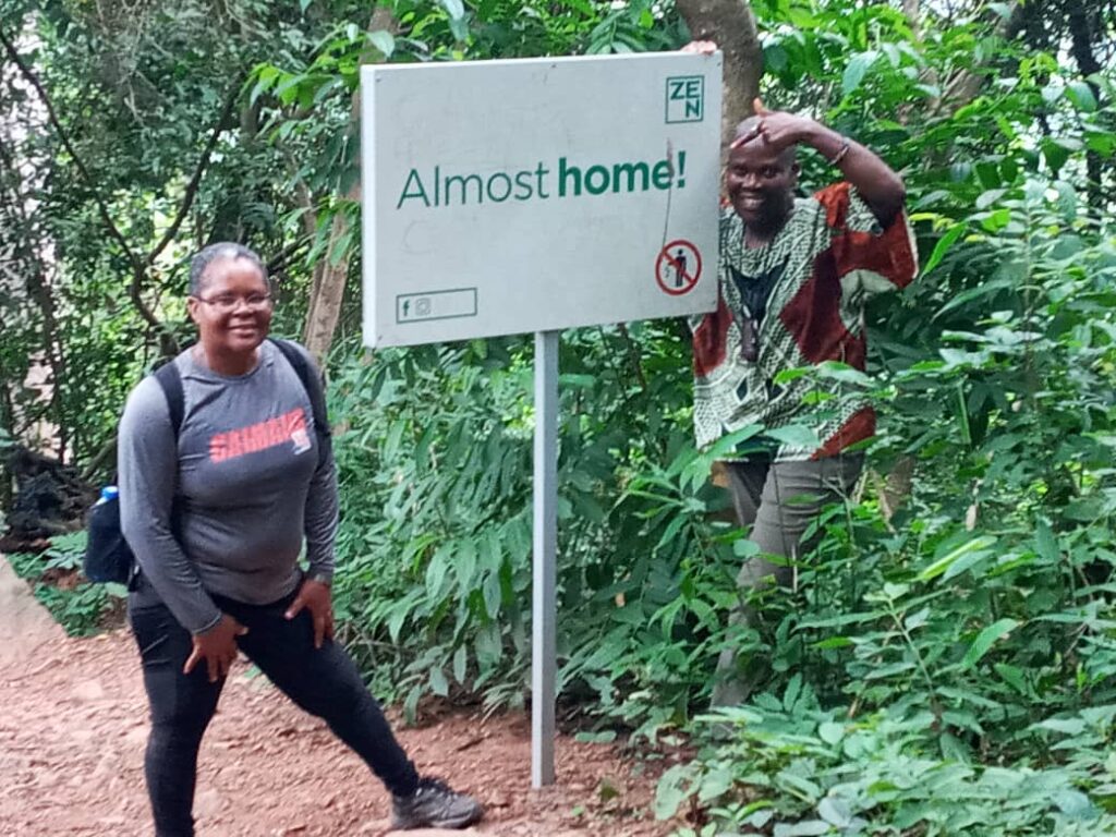 Two women climbing the highest mountain Afadjato in Ghana