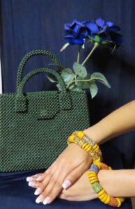 Handmade beaded green bag and handmade bracelets